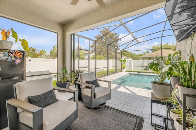 5849 Ansley Way, Mount Dora, FL 32757 - view of swimming pool featuring a ceiling fan, a patio area, a fenced backyard, and glass enclosure