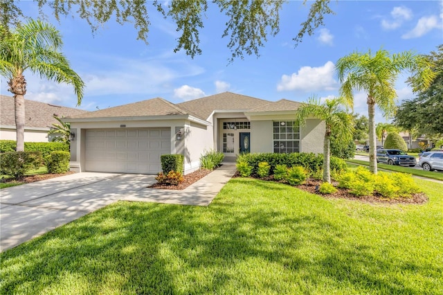 5849 Ansley Way, Mount Dora, FL 32757 - ranch-style home with stucco siding, a garage, a front lawn, and driveway