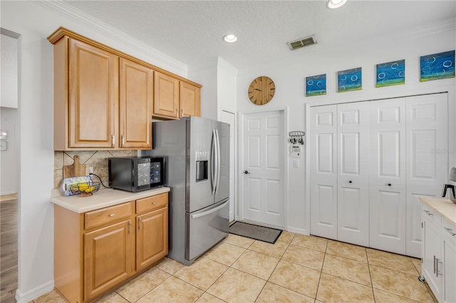 5849 Ansley Way, Mount Dora, FL 32757 - kitchen featuring light countertops, stainless steel refrigerator with ice dispenser, backsplash, crown molding, and light tile patterned floors