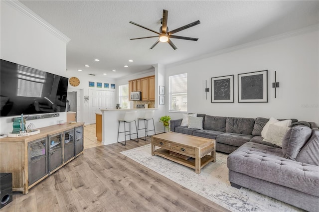 5849 Ansley Way, Mount Dora, FL 32757 - living area featuring ceiling fan, crown molding, light wood-style floors, and recessed lighting