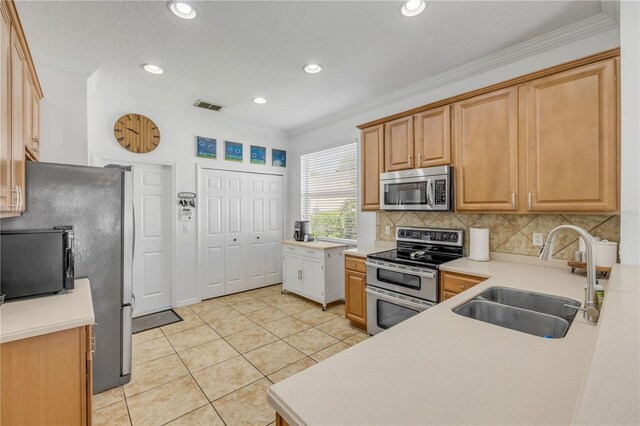 5849 Ansley Way, Mount Dora, FL 32757 - kitchen with appliances with stainless steel finishes, ornamental molding, decorative backsplash, light countertops, and light tile patterned flooring