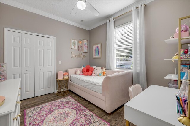 5849 Ansley Way, Mount Dora, FL 32757 - bedroom featuring ornamental molding, wood finished floors, a closet, a ceiling fan, and a textured ceiling