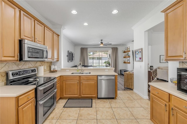 5849 Ansley Way, Mount Dora, FL 32757 - kitchen with appliances with stainless steel finishes, a peninsula, tasteful backsplash, ceiling fan, and recessed lighting