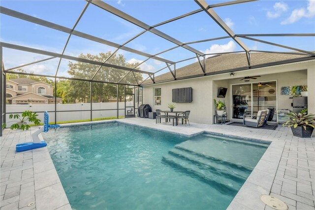 5849 Ansley Way, Mount Dora, FL 32757 - view of swimming pool featuring a patio area, ceiling fan, and a lanai