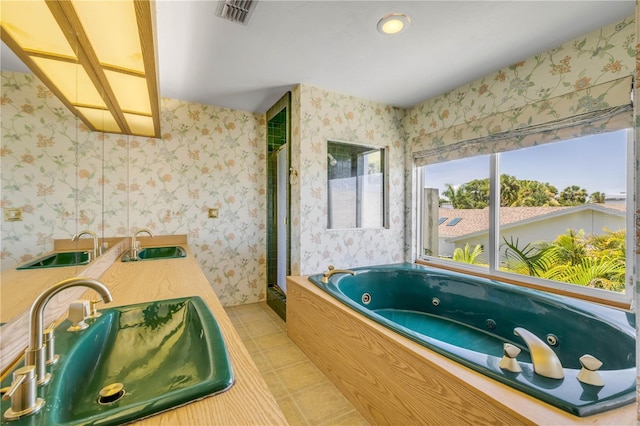 1219 Commodore Dr, New Smyrna Beach, FL 32168 - bathroom featuring a whirlpool tub, wallpapered walls, a shower stall, and tile patterned floors