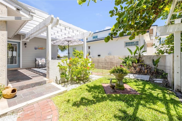 1219 Commodore Dr, New Smyrna Beach, FL 32168 - fenced yard with a patio area and a pergola