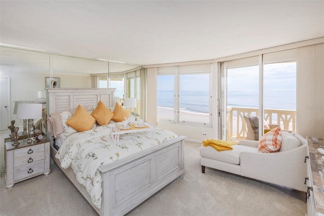 1051 Ocean Shore Blvd Unit 502, Ormond Beach, FL 32176 - bedroom with light colored carpet and a water view
