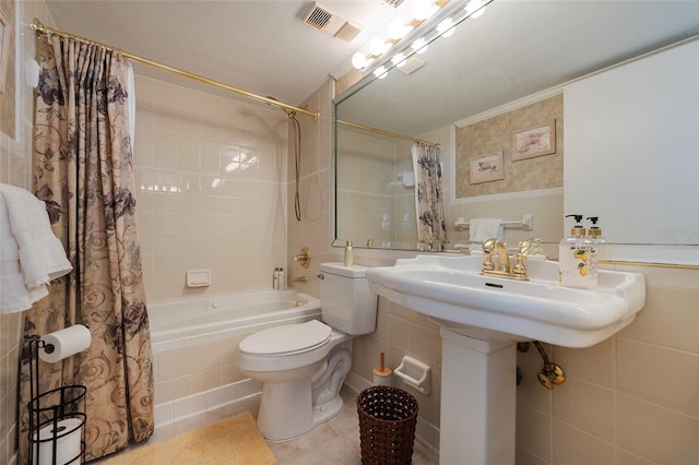 1051 Ocean Shore Blvd Unit 502, Ormond Beach, FL 32176 - bathroom featuring tile walls, shower / bath combo, and tile patterned floors