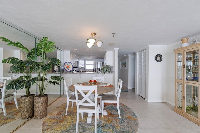1051 Ocean Shore Blvd Unit 502, Ormond Beach, FL 32176 - dining area featuring light tile patterned floors and a chandelier