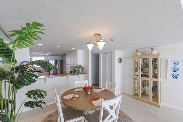 1051 Ocean Shore Blvd Unit 502, Ormond Beach, FL 32176 - dining room featuring light tile patterned floors and a chandelier
