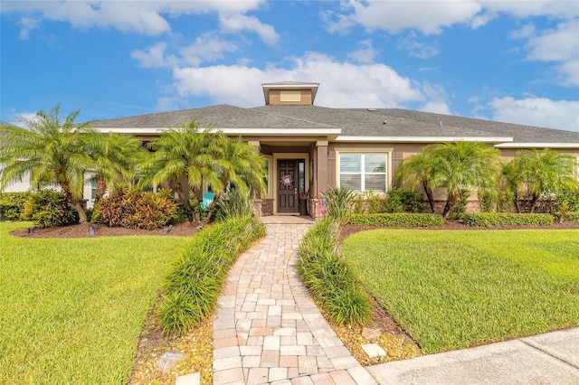 2939 Bella Flore Ter, New Smyrna Beach, FL 32168 - single story home featuring a front yard and stucco siding