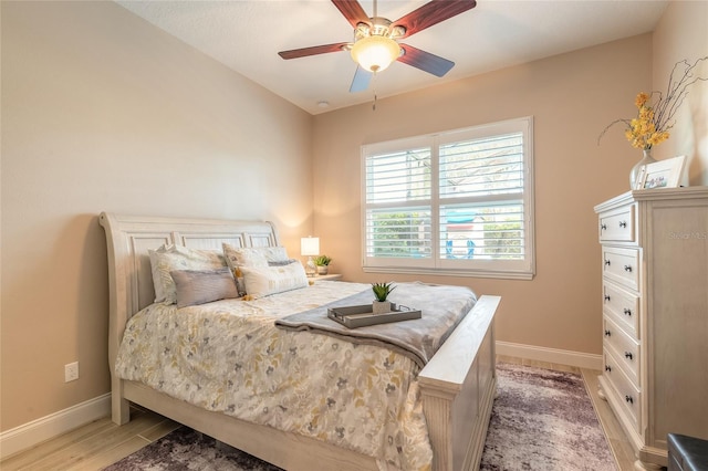 2939 Bella Flore Ter, New Smyrna Beach, FL 32168 - bedroom with light wood finished floors and a ceiling fan