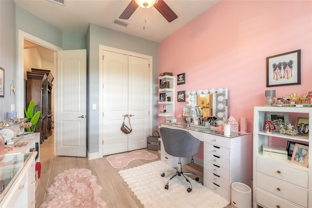2939 Bella Flore Ter, New Smyrna Beach, FL 32168 - home office with a ceiling fan and light wood finished floors