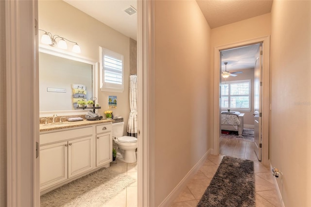 2939 Bella Flore Ter, New Smyrna Beach, FL 32168 - ensuite bathroom with vanity, tile patterned floors, and ceiling fan