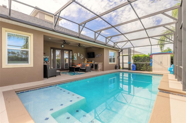 2939 Bella Flore Ter, New Smyrna Beach, FL 32168 - outdoor pool featuring a storage unit, ceiling fan, french doors, a patio, and outdoor lounge area
