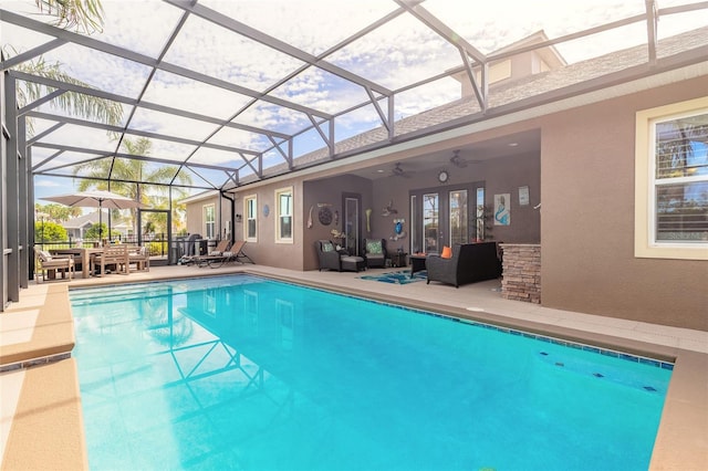 2939 Bella Flore Ter, New Smyrna Beach, FL 32168 - swimming pool featuring an outdoor hangout area, a ceiling fan, a patio area, and a lanai