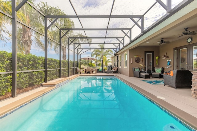 2939 Bella Flore Ter, New Smyrna Beach, FL 32168 - swimming pool featuring an outdoor living space, a patio, ceiling fan, and glass enclosure