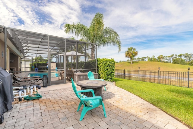 2939 Bella Flore Ter, New Smyrna Beach, FL 32168 - fenced backyard featuring glass enclosure, a patio area, and a jacuzzi