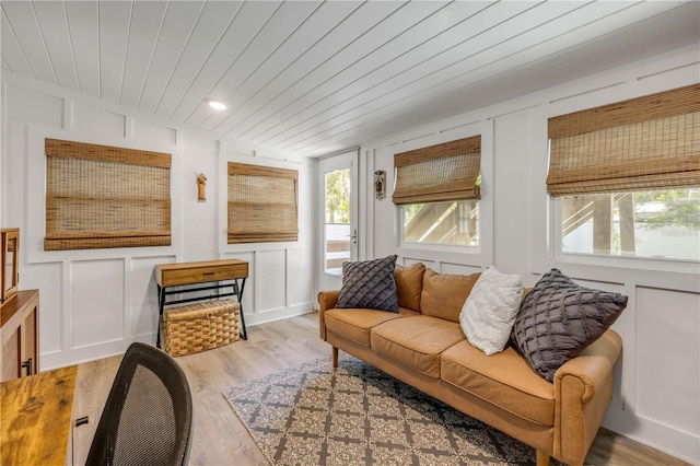 402 N Orange St, New Smyrna Beach, FL 32168 - living area with a decorative wall, light wood-style floors, wooden ceiling, and recessed lighting