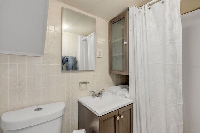 402 N Orange St, New Smyrna Beach, FL 32168 - bathroom featuring vanity, tile walls, decorative backsplash, and curtained shower