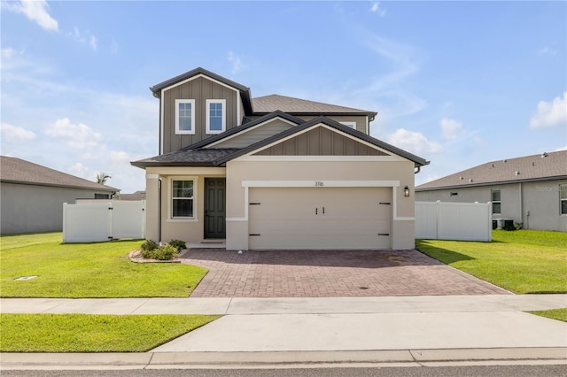 3116 Crab Trap Dr, New Smyrna Beach, FL 32168 - view of front of home with board and batten siding, decorative driveway, and an attached garage