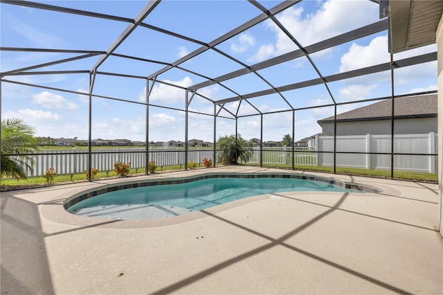 3116 Crab Trap Dr, New Smyrna Beach, FL 32168 - view of pool with a patio area, a water view, and glass enclosure