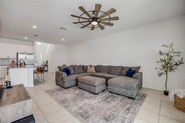 3116 Crab Trap Dr, New Smyrna Beach, FL 32168 - living room with a ceiling fan, light tile patterned flooring, and recessed lighting