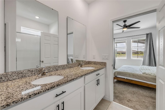 3116 Crab Trap Dr, New Smyrna Beach, FL 32168 - bathroom with connected bathroom, double vanity, ceiling fan, and tile patterned floors