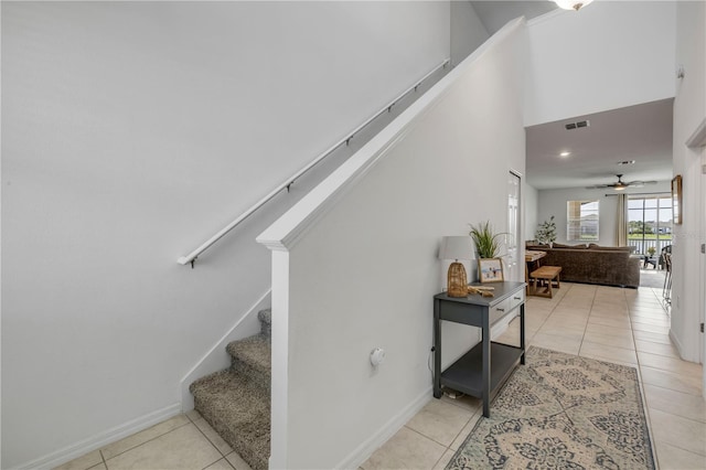 3116 Crab Trap Dr, New Smyrna Beach, FL 32168 - stairway with tile patterned flooring and ceiling fan