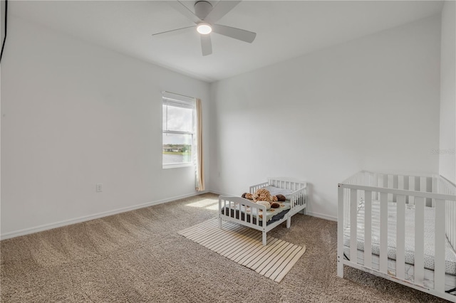 3116 Crab Trap Dr, New Smyrna Beach, FL 32168 - carpeted bedroom featuring a ceiling fan and a crib