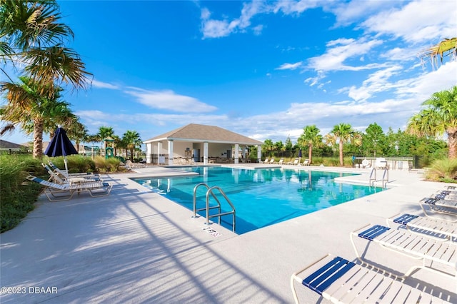 3116 Crab Trap Dr, New Smyrna Beach, FL 32168 - community pool featuring a patio area
