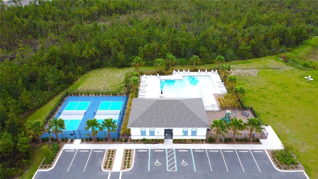 3116 Crab Trap Dr, New Smyrna Beach, FL 32168 - drone / aerial view of a pool and a heavily wooded area