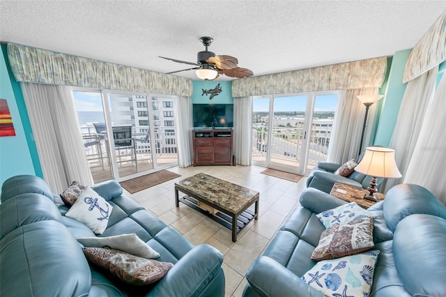 2967 S Atlantic Ave Unit 508, Daytona Beach, FL 32118 - living room featuring a ceiling fan and a textured ceiling