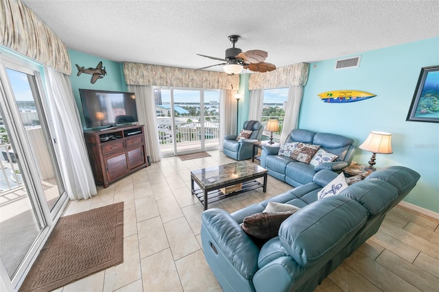 2967 S Atlantic Ave Unit 508, Daytona Beach, FL 32118 - living area featuring a textured ceiling and ceiling fan