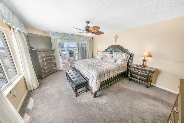 2967 S Atlantic Ave Unit 508, Daytona Beach, FL 32118 - bedroom with access to exterior, light carpet, ceiling fan, and a textured ceiling
