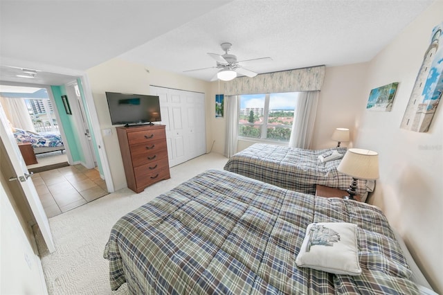 2967 S Atlantic Ave Unit 508, Daytona Beach, FL 32118 - bedroom with carpet flooring, a closet, and a ceiling fan