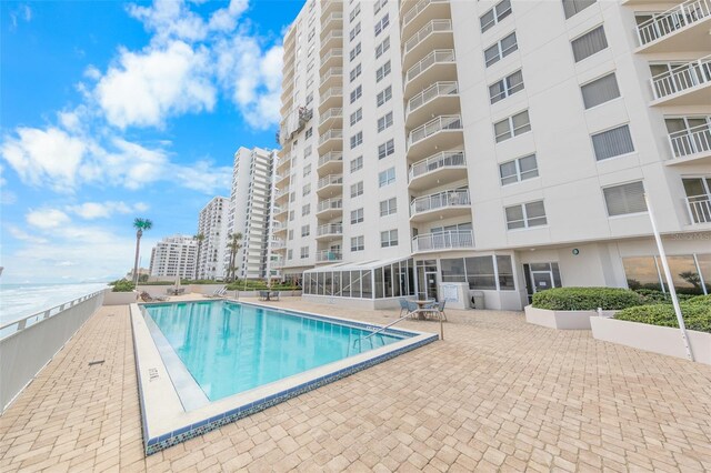 2967 S Atlantic Ave Unit 508, Daytona Beach, FL 32118 - community pool featuring a patio