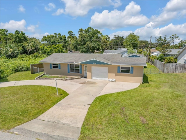 2416 Pine Tree Dr, Edgewater, FL 32141 - ranch-style home with a garage and driveway