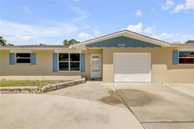 2416 Pine Tree Dr, Edgewater, FL 32141 - single story home featuring concrete driveway and a garage