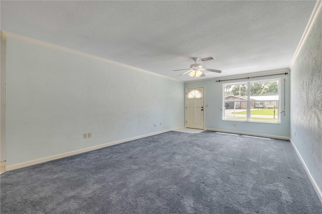 2416 Pine Tree Dr, Edgewater, FL 32141 - carpeted spare room featuring a textured ceiling, ornamental molding, and a ceiling fan
