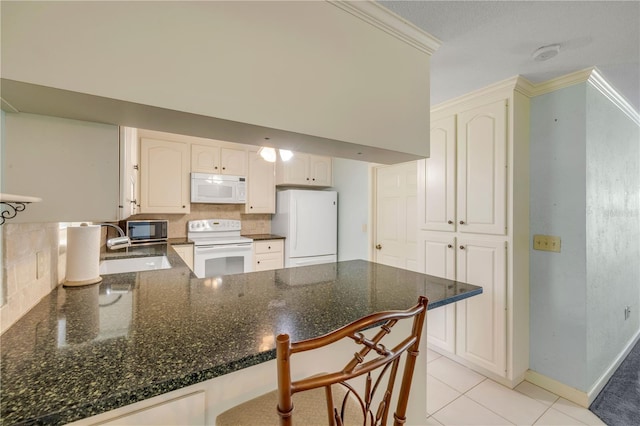 2416 Pine Tree Dr, Edgewater, FL 32141 - kitchen with white appliances, a peninsula, tasteful backsplash, crown molding, and dark stone counters