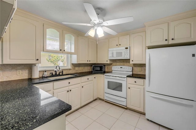 2416 Pine Tree Dr, Edgewater, FL 32141 - kitchen with white appliances, cream cabinets, tasteful backsplash, a ceiling fan, and light tile patterned flooring