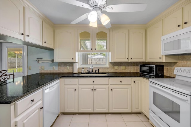 2416 Pine Tree Dr, Edgewater, FL 32141 - kitchen featuring white appliances, a peninsula, cream cabinetry, and a ceiling fan