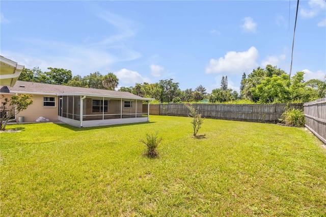 2416 Pine Tree Dr, Edgewater, FL 32141 - fenced backyard with a sunroom