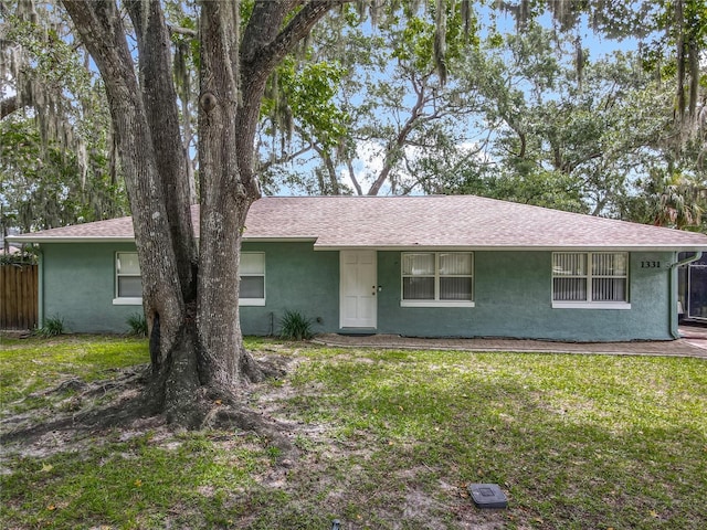 1331 Needle Palm Dr, Edgewater, FL 32132 - ranch-style home featuring stucco siding and roof with shingles