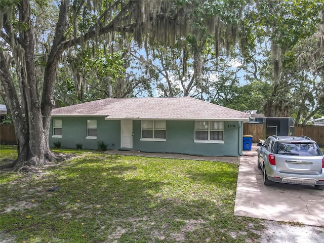 1331 Needle Palm Dr, Edgewater, FL 32132 - single story home with stucco siding and roof with shingles