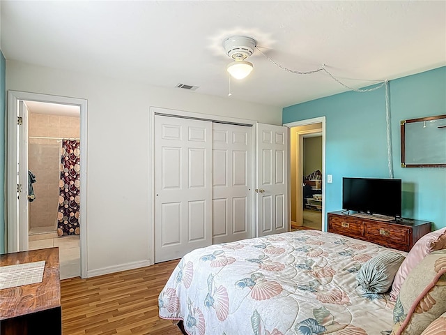 1331 Needle Palm Dr, Edgewater, FL 32132 - bedroom with light wood-style flooring, a closet, and connected bathroom