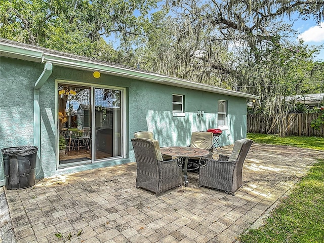 1331 Needle Palm Dr, Edgewater, FL 32132 - view of patio with view of scattered trees