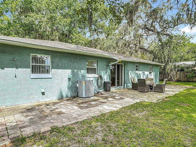 1331 Needle Palm Dr, Edgewater, FL 32132 - rear view of property with a patio and stucco siding