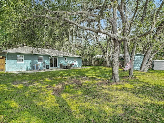 1331 Needle Palm Dr, Edgewater, FL 32132 - view of yard with a storage unit